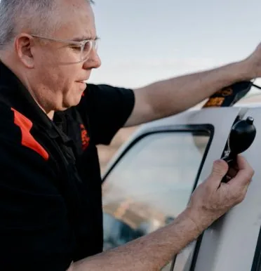 Doug McGrail unlocking a car for a customer in Billings, MT